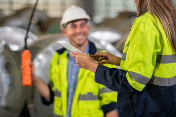 Wall Mural - Factory apprenticeship. Woman mentor teaching man employee trainee operating machine look monitors and hand press control button process machinery. Leader foreman explaining engineer control machine