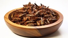 Fried Crickets In A Wooden Bowl On A White Background.
