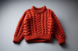 © Werckmeister - Red knitted sweater background with traditional design, Knit woolen texture. Red knitted Christmas turtleneck sweater