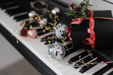 Wall Mural - Piano keyboard with Christmas decoration, closeup.