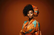 © staras - Young beauty stylish african american woman in a turban on orange background, closeup portrait of black fashion girl with beautiful makeup and hairstyle
