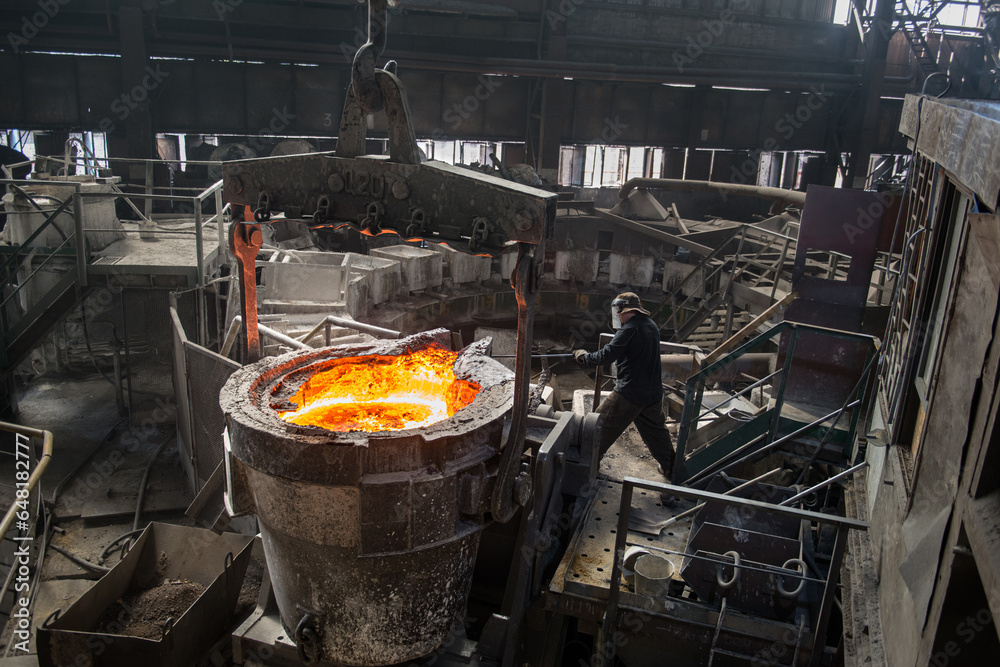 Steelworker at work near the tanks with hot metal Stock Photo | Adobe Stock