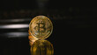 Golden coins with bitcoin symbol and black backround