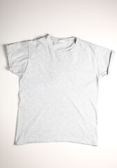 Wall Mural - Cotton gray t-shirt on a white background. Top view