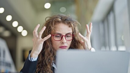 Poster - Young woman business worker using laptop angry at the office