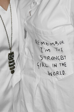 White clothes, light fashion and style, decoration, English lettering on the pocket, close-up, soft focus