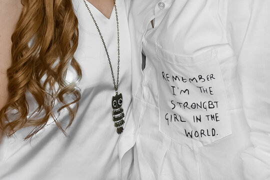 White clothes, light person fashion and style, decoration, English lettering on the pocket, close-up, soft focus