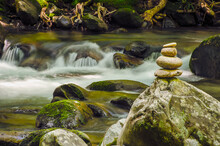 Waterfalls In Little Pigeon River And A Pile Of Rocks On The Shore In Great Smoky Mountains National Park; Tennessee United States Of America