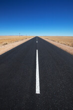 White Line On A Paved Road In The Desert; Garub Namibia