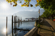 Sunlight Reflecting On Lake Maggiore Beside The Promenade; Locarno Ticino Switzerland