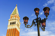 A Tower And Lamp Post In Piazza San Marco; Venice, Italy