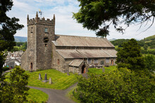 Stone Church With Clock Tower And Cemetery In A Village; Hawkshead, Cumbria, England