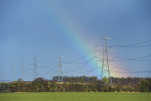 Rainbow Behind High Voltage Electricity Cables Near Great Wilbraham; Cambridgeshire, England