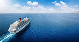 Fototapeta Uliczki - Aerial view of a generic cruise ship traveling with speed over blue ocean with copy space