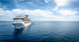Fototapeta Uliczki - Aerial front view of a generic cruise ship traveling with speed over blue ocean with copy space