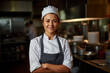 Smiling female chef in her restaurant, women owned business concept