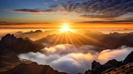 Wall Mural - sunrise, above the clouds from a mountain peak, sun creating a halo effect