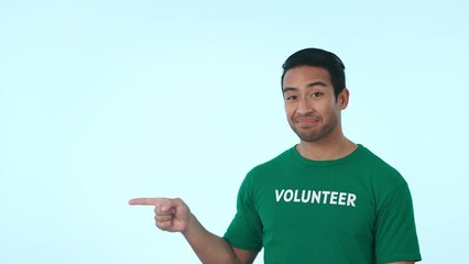 Poster - Mock up, pointing and face of volunteer in studio for marketing, promotion or advertising. Choice, options and portrait of Indian man charity worker with approval hand gesture by white background.