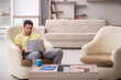 © Elnur - Young man working from home during pandemic