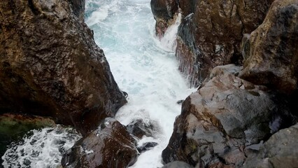 Wall Mural - Footage of waves crashing off the north coast of Madeira at Porto Moniz on cloudy day