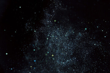 Wall Mural - macro shot of dust particles on black background