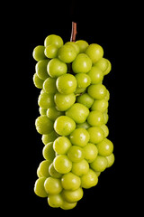 Wall Mural - one bunch of fresh green shine muscat grape isolated on black background