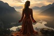 © PinkiePie - A young woman practicing yoga on a mountaintop with a magnificent view