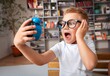 © BillionPhotos.com - School boy dreaming with alarm clock in classroom