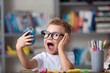 © BillionPhotos.com - School boy dreaming with alarm clock in classroom