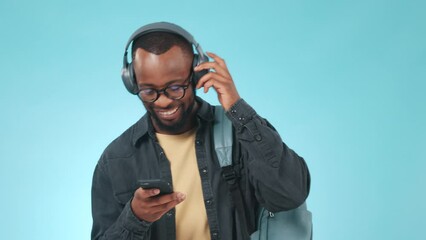 Sticker - Black man, headphones and student with phone for music, radio or audio and dancing on blue background for study break. Listen, happy and person with media streaming hip hop or sound in studio for joy