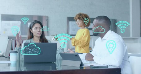 Poster - Digital communication icons over diverse female and male colleague at casual office meeting