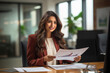 © PRASANNAPIX - Indian businesswoman or corporate employee working at office.