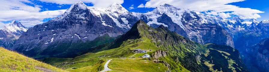 Wall Mural - Swiss nature scenery. Scenic snowy Alps mountains Beauty in nature. Switzerland landscape. View of Mannlichen mountain and famous hiking route 