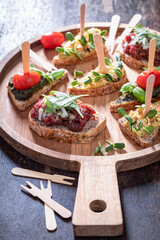 Wall Mural - Homemade bruschetta with tomato and pesto for breakfast