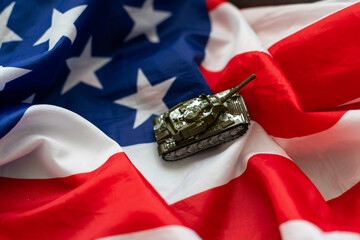 Wall Mural - Toy model tank on USA national flag.