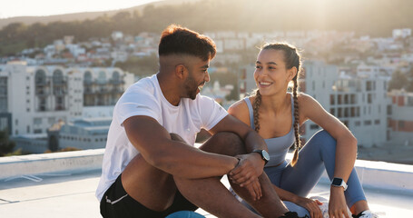 Sticker - Couple, fitness and city to rest and talk for exercise, workout or training together on rooftop. Happy man and woman on sports break with a laugh, communication or conversation about wellness