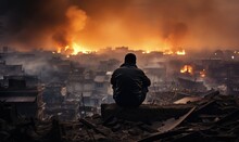A Burning City After An Attack: Destruction, Fire, And Smoke. Back View Of A Solitary Man Within The Chaos, Witnessing The Horror, Despair, And Loss Of War.