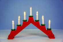 Traditional Christmas Candle Holder With Seven Candles On A Blue Background