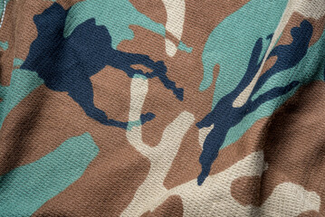 Military camouflage cloth pattern texture, alternating colors on a beautiful cloth background image.
