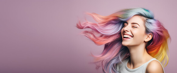 Wall Mural - Young beautiful smiling happy woman with rainbow colored wavy hair isolated on flat purple background with copy space, banner template of Creative hair coloring.