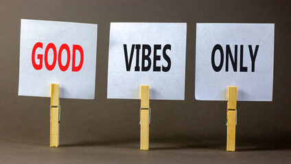 Wall Mural - Good vibes only symbol. Concept word Good vibes only on beautiful white paper on wooden clothespin. Beautiful grey table grey background. Business motivational good vibes only concept. Copy space.