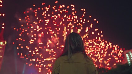 Wall Mural - woman look beautiful colorful holiday new year festivity celebration fireworks in the night sky, fes
