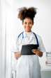 © Daenin - african american female doctor at her clinic medical and health concept