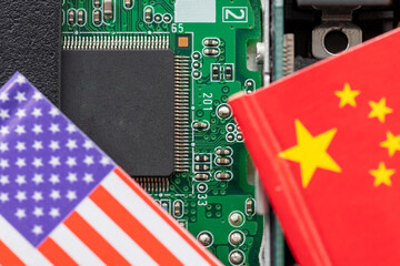 Wall Mural - A technology conflict, competition concept with the American and Chinese flags on top of a semiconductor circuit board.