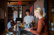 © Marko Geber - Young and diverse group of friends washing dishes after breakfast in their flatshare apartment
