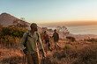 © Marko Geber - Diverse and young group of friends watching the sunset after conquering a mountain in Africa
