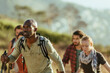 © Marko Geber - Young and diverse group of people hiking together in Africa
