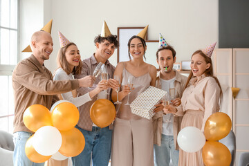 Canvas Print - Group of young friends with champagne celebrating Birthday at home