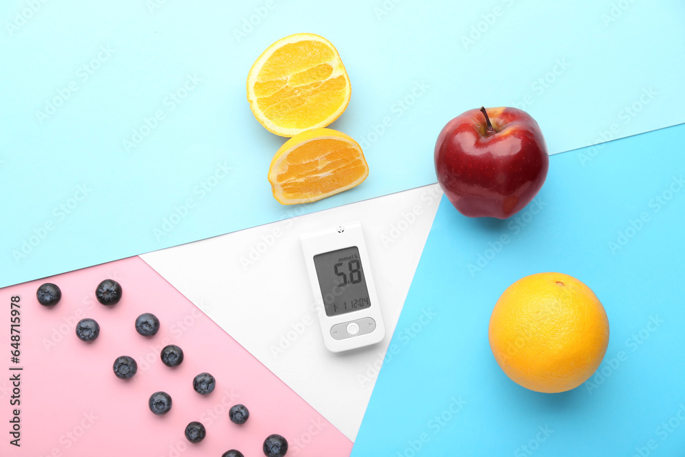 Glucometer with food on color background. Diabetes concept