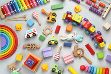 Different Children's Toys On Light Grey Background, Flat Lay